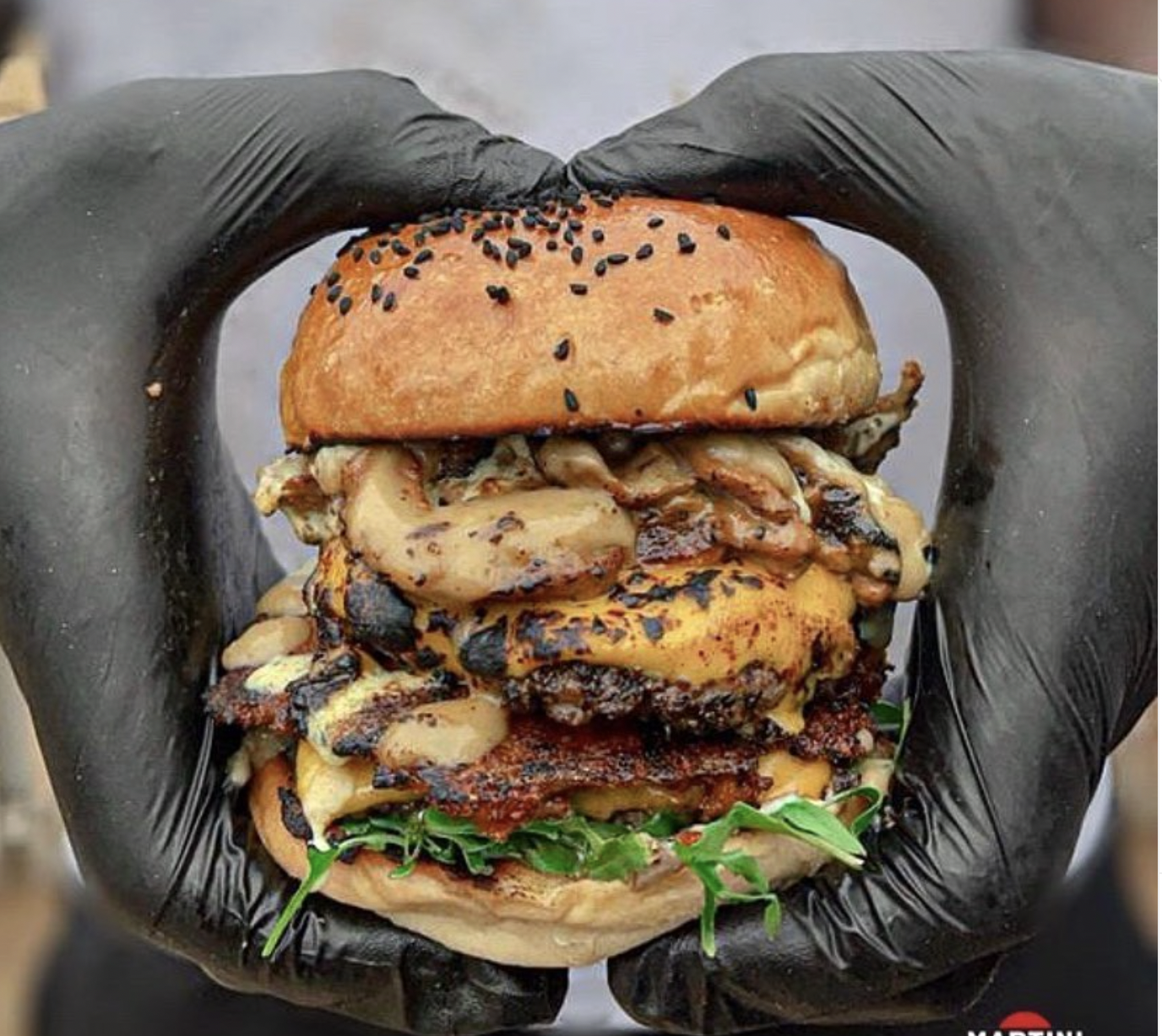 Loaded smash burger held up